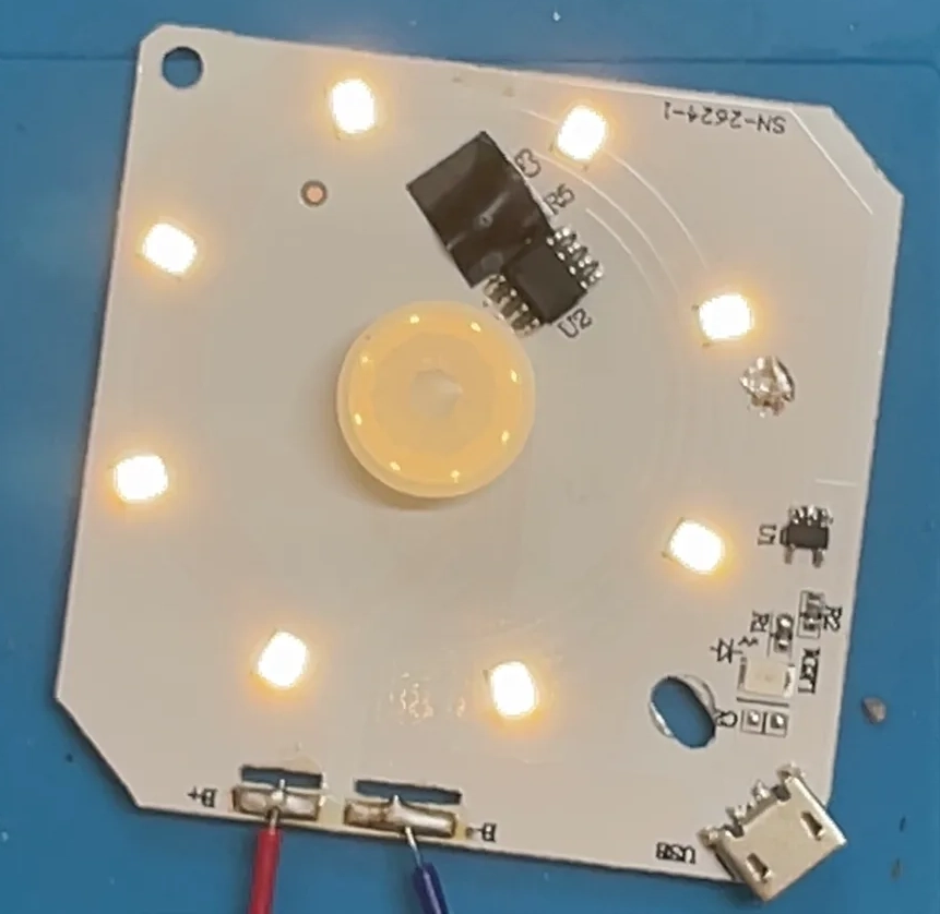 Board running on the bench supply with the LEDs lit