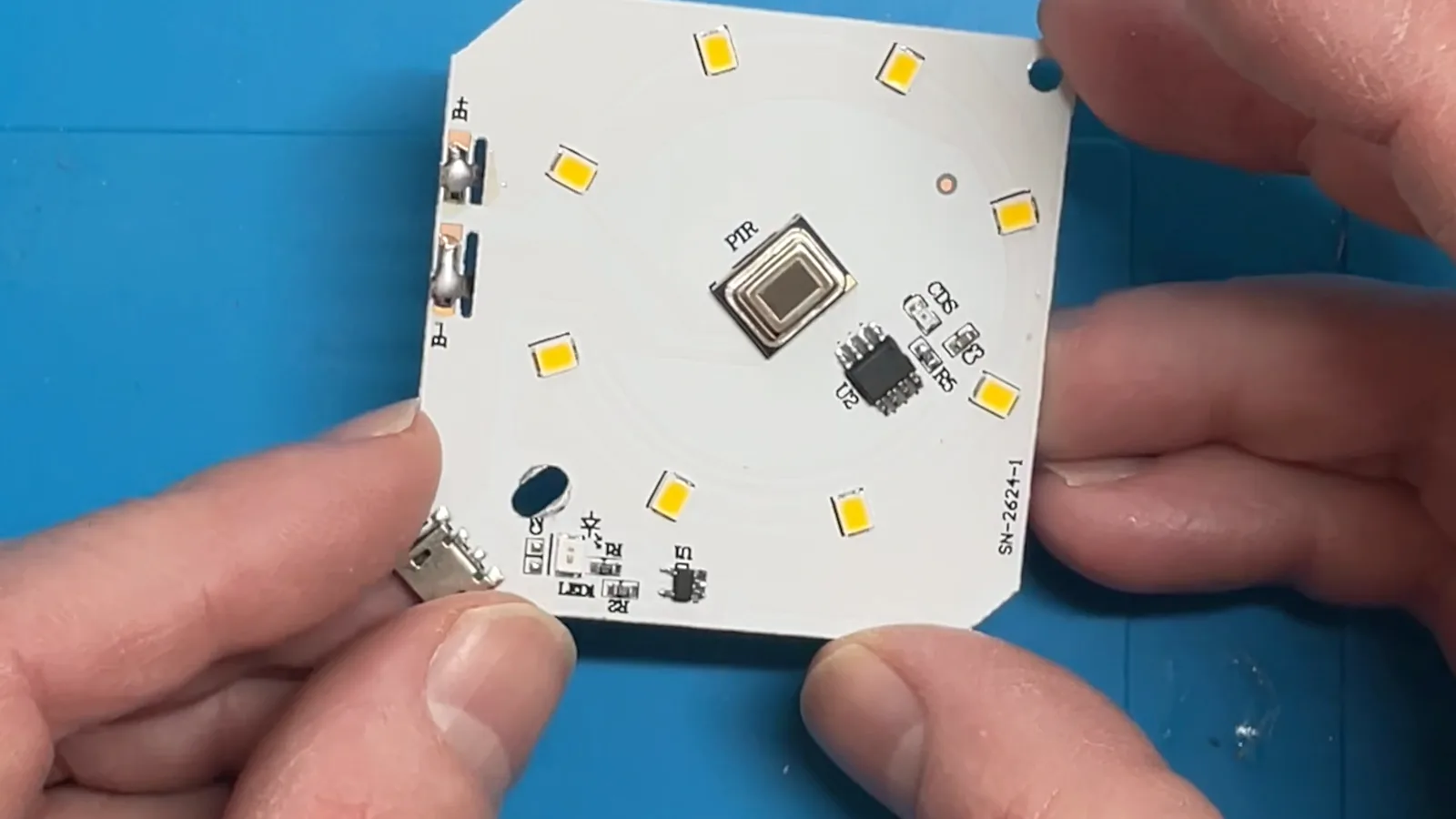 The stripped PCB showing PIR sensor, U2 chip, LDR and LEDs